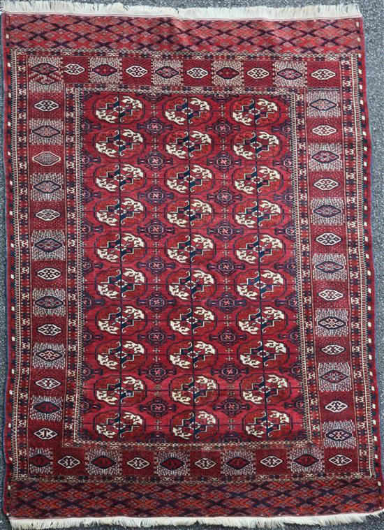 A Bokhara rug, 6ft 1in by 4ft 6in.